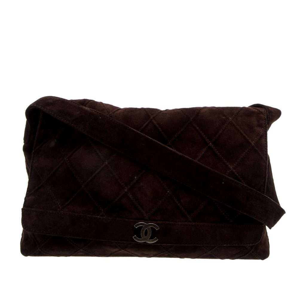 Brown quilted handbag with Chanel logo on a white background